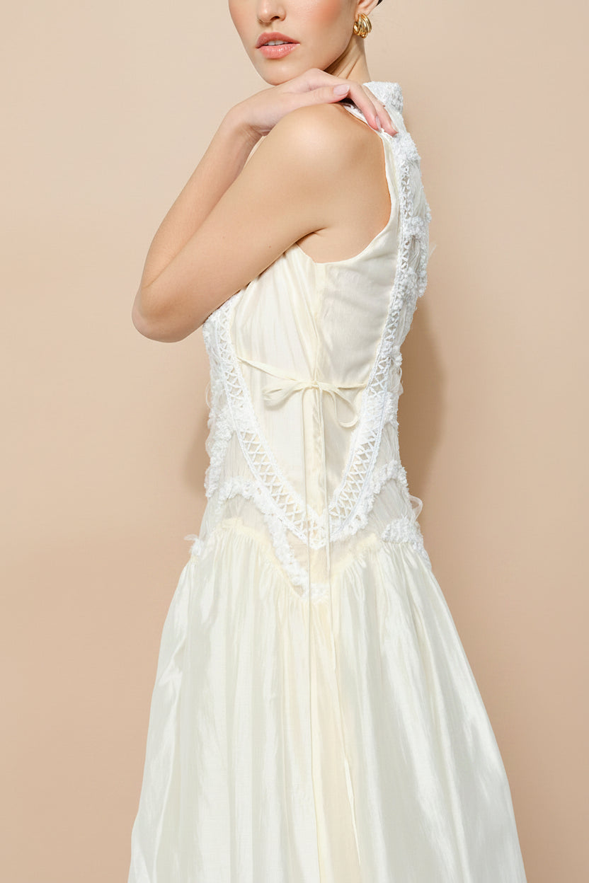 side close-up of a woman wearing Shania Ivory Sleeveless Midi Dress with Textured Details from Boudoir 1861