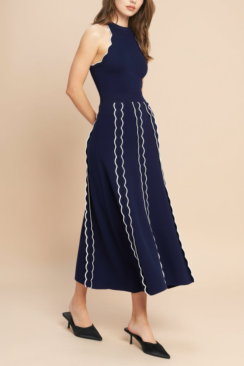 side view of a woman wearing Sharleen Navy Knit Sleeveless Midi Dress from Boutique 1861 