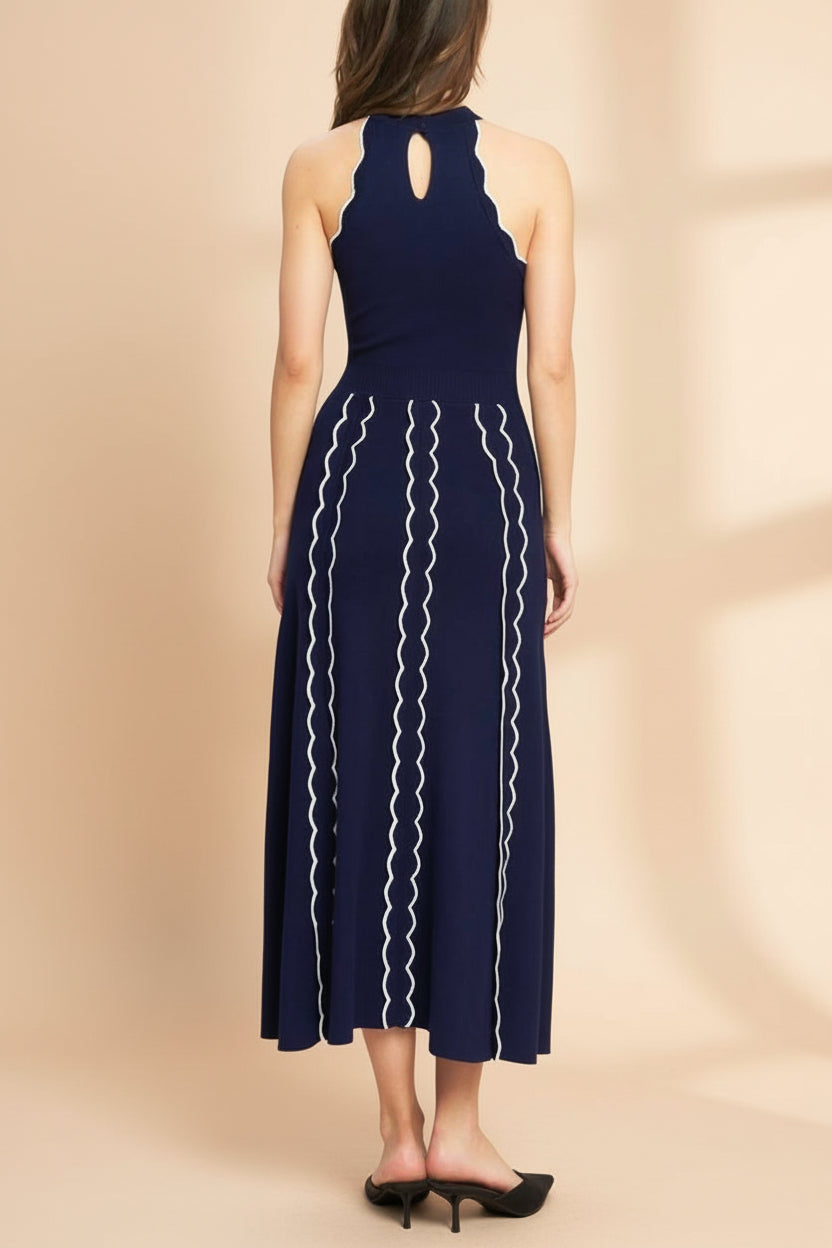 back view of a woman wearing Sharleen Navy Knit Sleeveless Midi Dress from Boutique 1861 