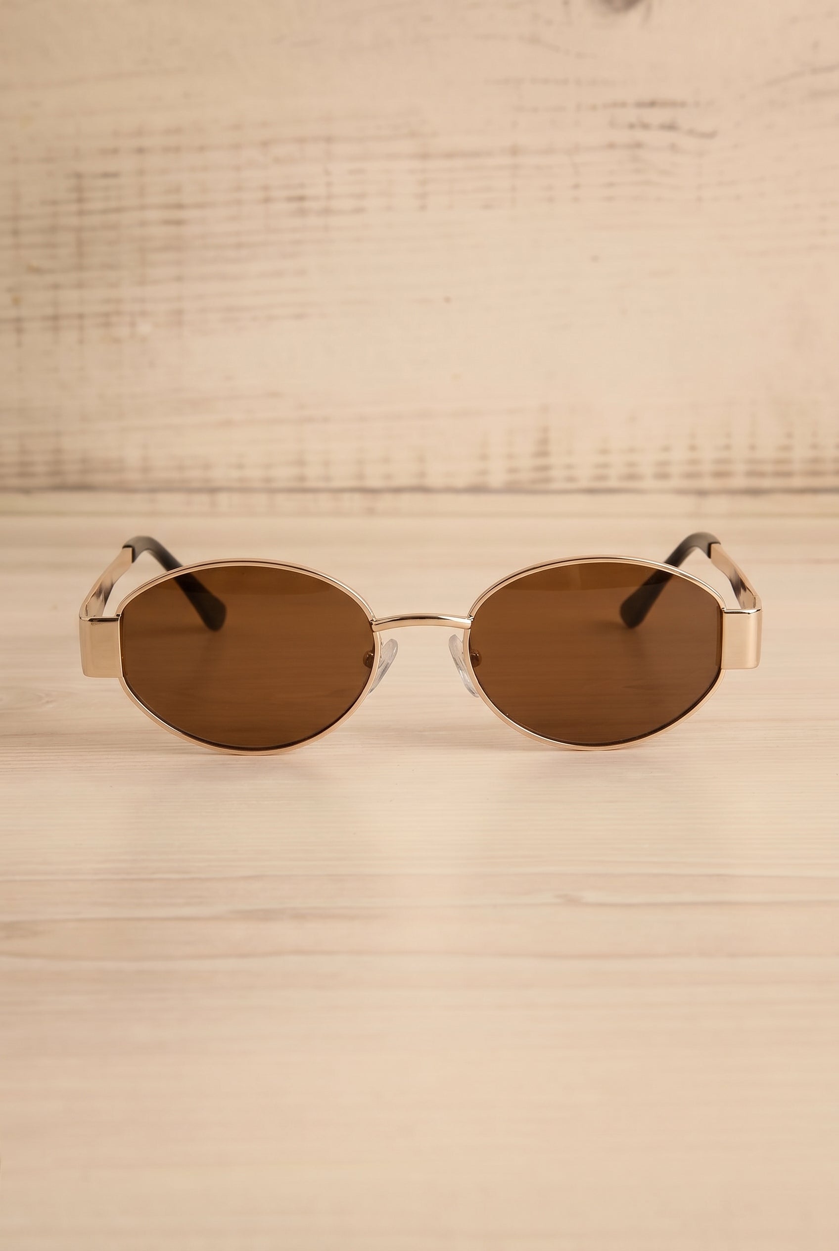 Frontview of Solstice Gold Oval Sunglasses with Brown Lenses at la petite garçonne