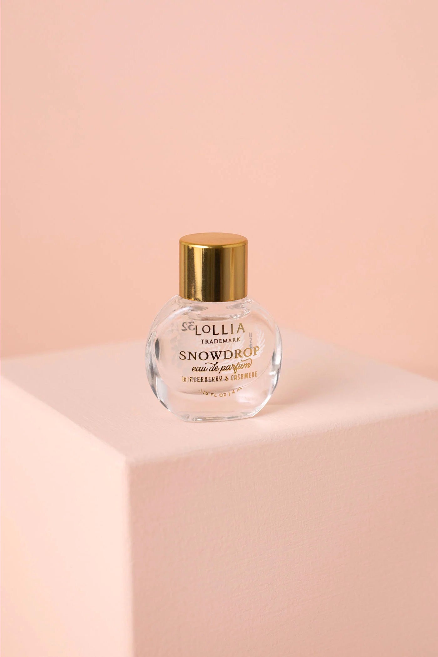 Snowdrop Mini Perfume | Maison garçonne on pink backdrop