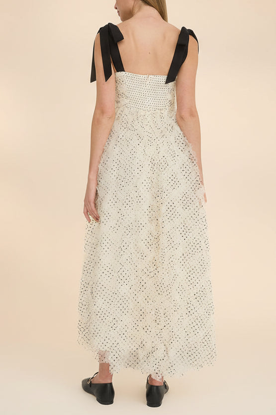 back view of a woman wearing Takako Long White Tulle Dress with Black Polka Dots from Boutique 1861