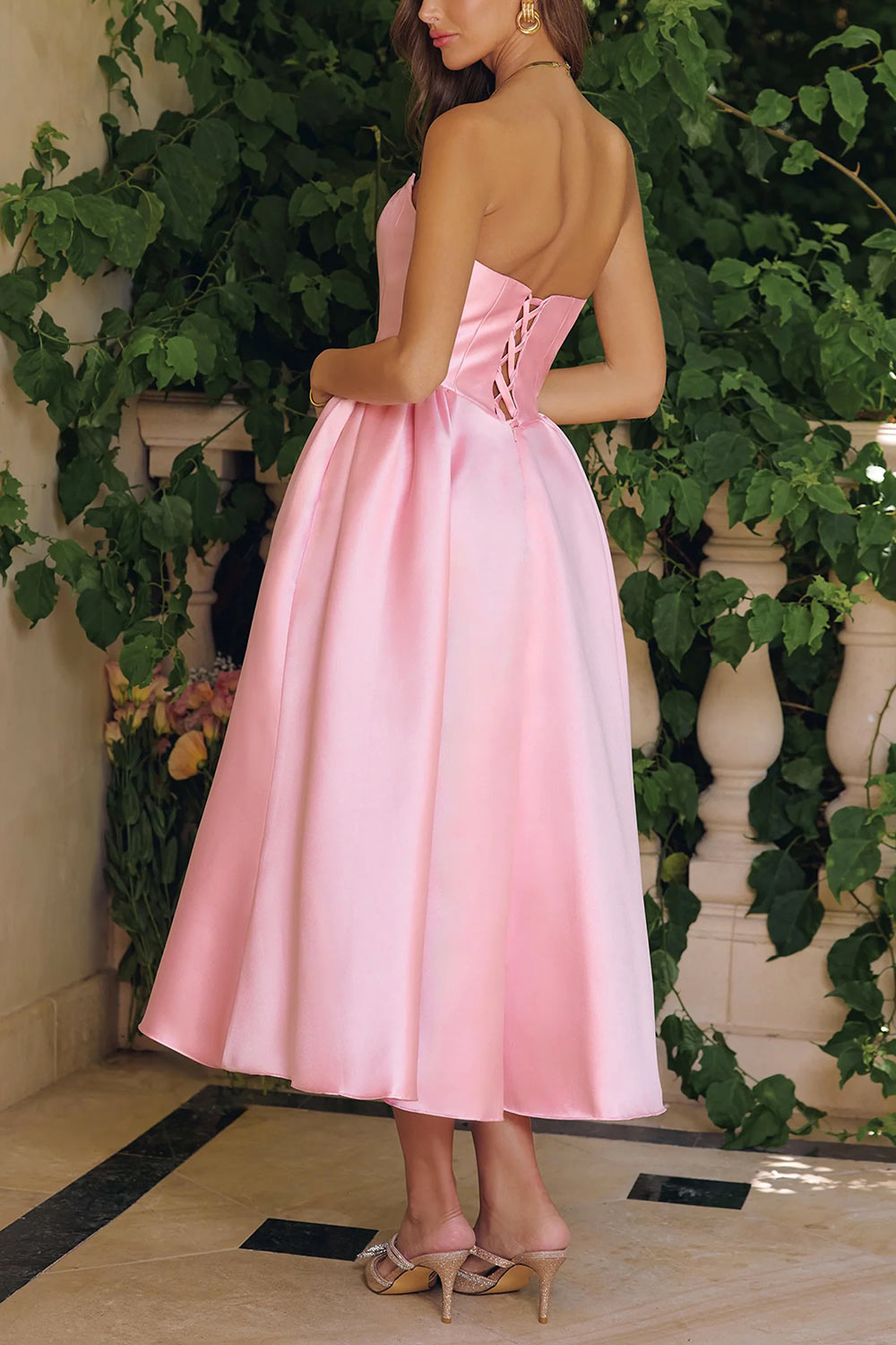 back of a woman wearing Thalya Blush Long Satin Dress with Fitted Bodice and Pockets | Boutique 1861