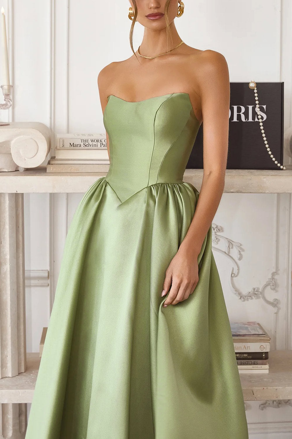 close-up of a woman wearing Thalya Sage Long Satin Dress with Fitted Bodice and Pockets from Boutique 1861