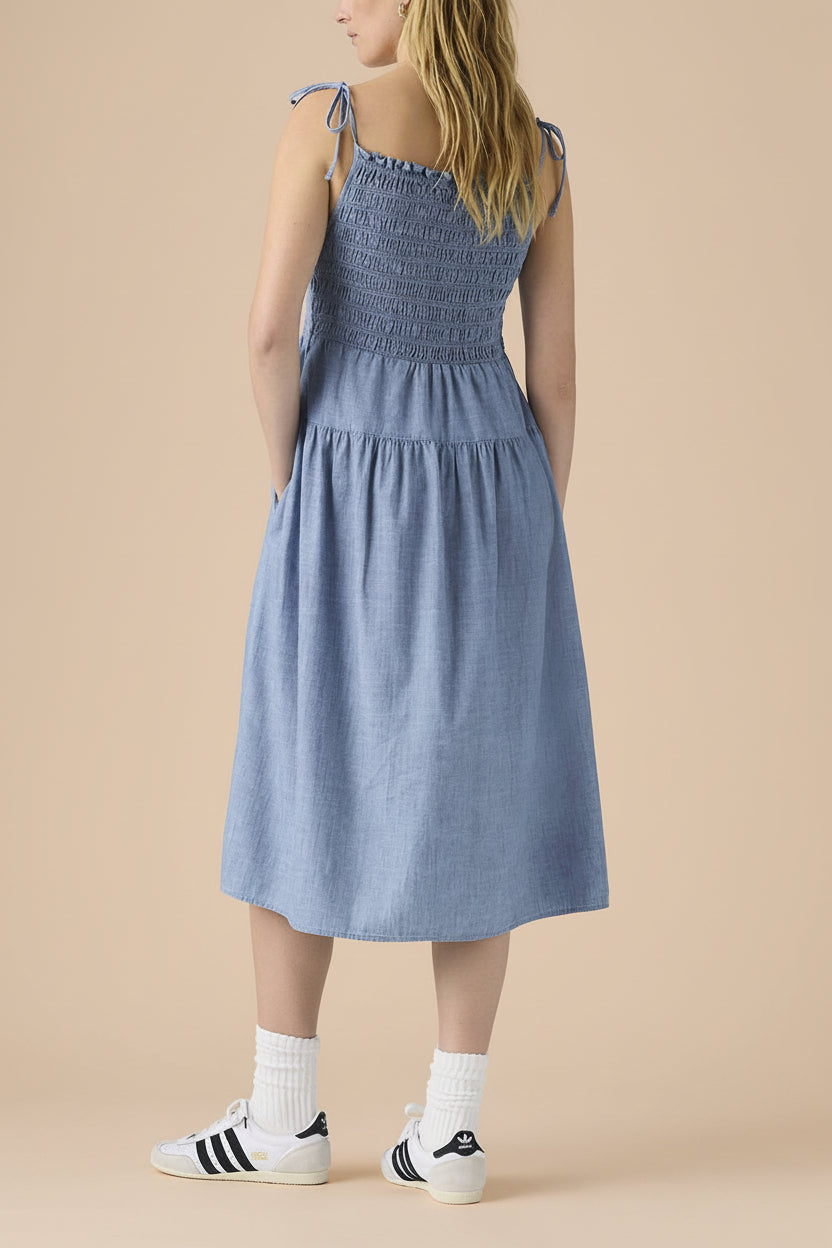 back of a woman wearing Tiannah Blue Denim Midi Dress with Pockets from La petite garçonne 