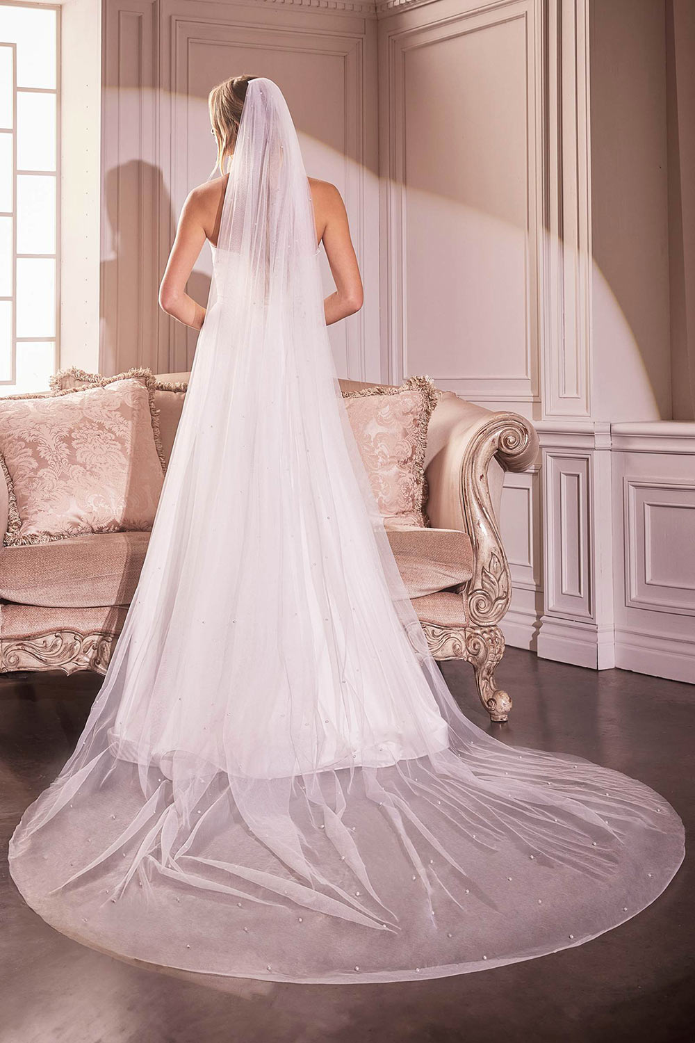 back of a woman wearing Trisha Royal Length White Veil with Pearls from Boudoir 1861