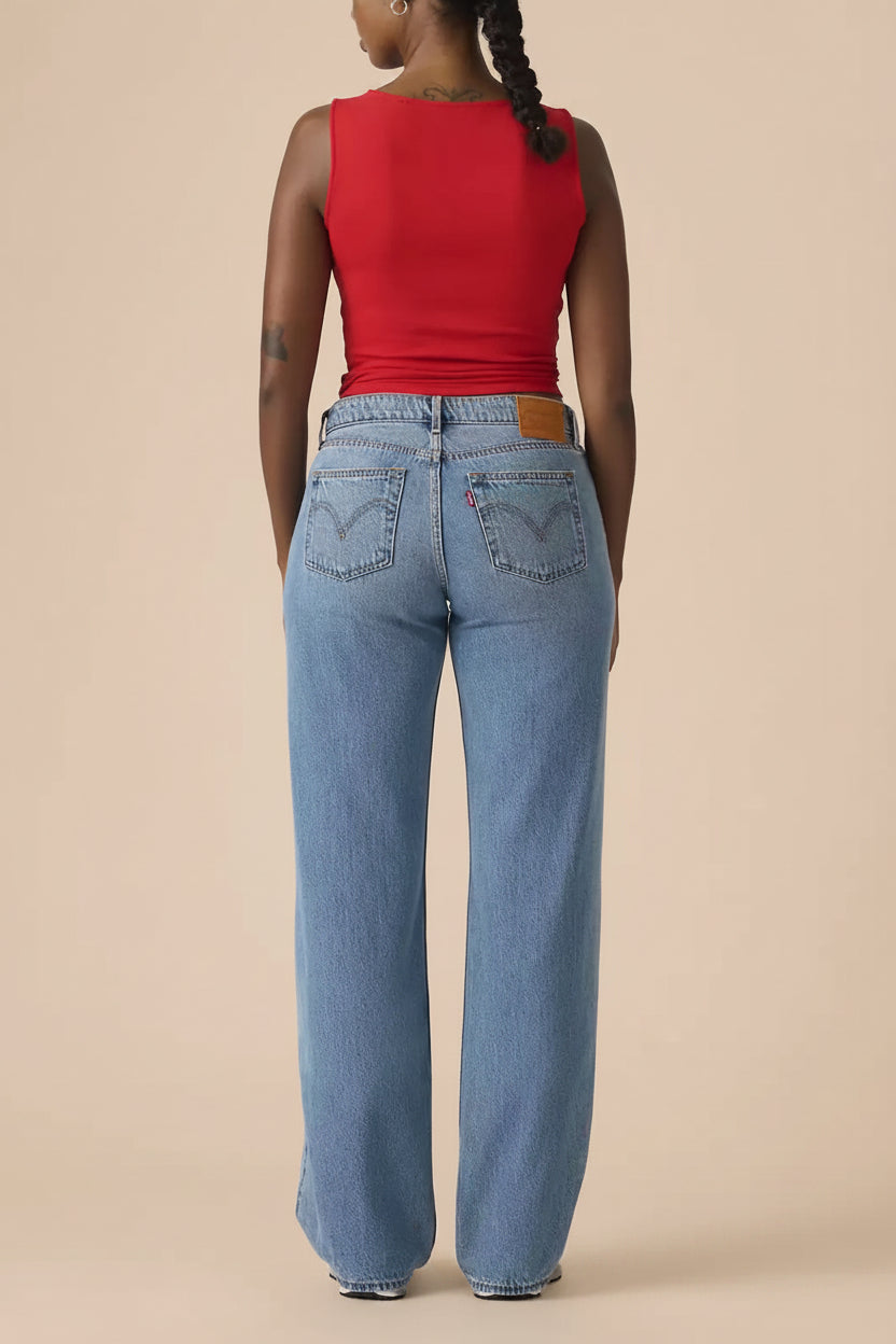 back of a woman wearing Tuscania Low Rise Blue Denim Pants from La petite garçonne 