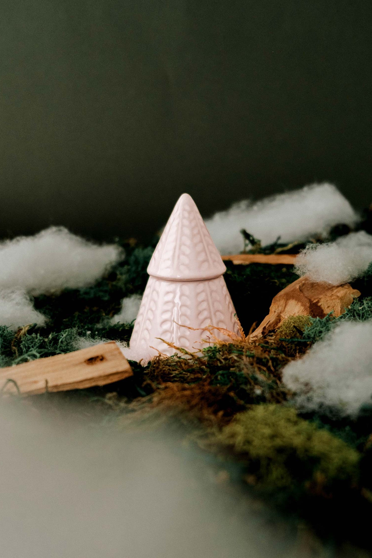 The Little Fir Tree Candle by mimi and august in a textured holder with cotton and greenery