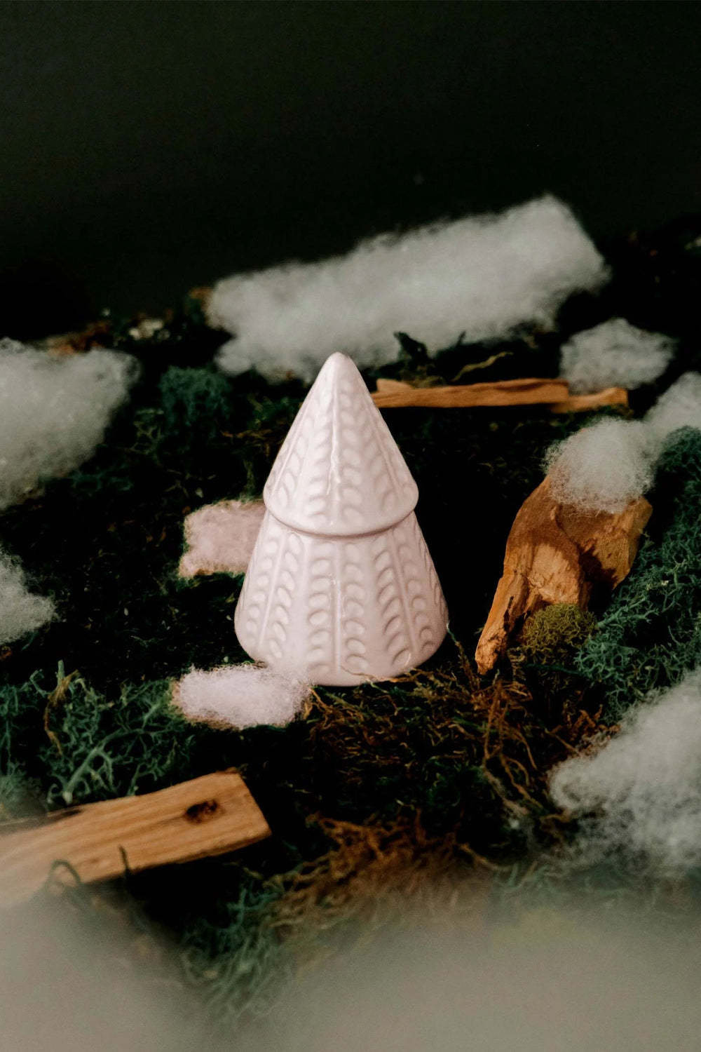 The Little Fir Tree Candle by mimi and august in a textured holder with cotton and greenery