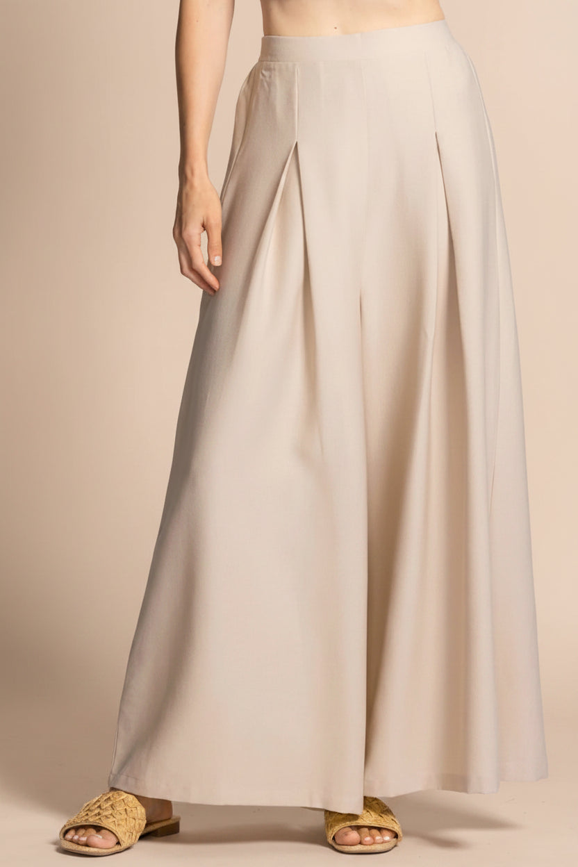 a woman wearing Varallo Beige Wide Leg Pants with Front Pleats from La petite garçonne