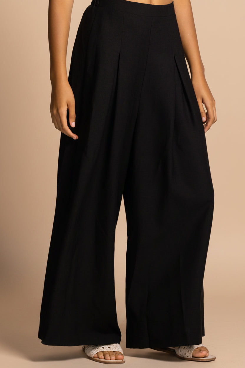 close-up of a woman wearing Varallo Black Wide Leg Pants with Front Pleats from La petite garçonne 