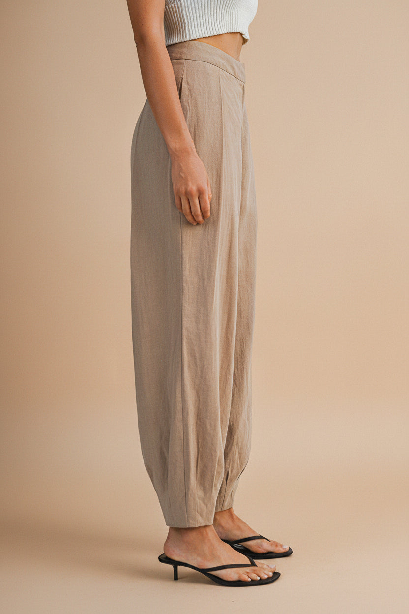 Profile of a Woman wearing the Veraval Taupe Barrel Cut Pants from la petite garçonne