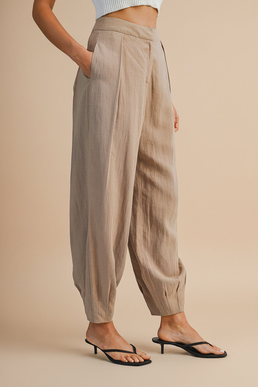Side view of a Woman wearing the Veraval Taupe Barrel Cut Pants from la petite garçonne