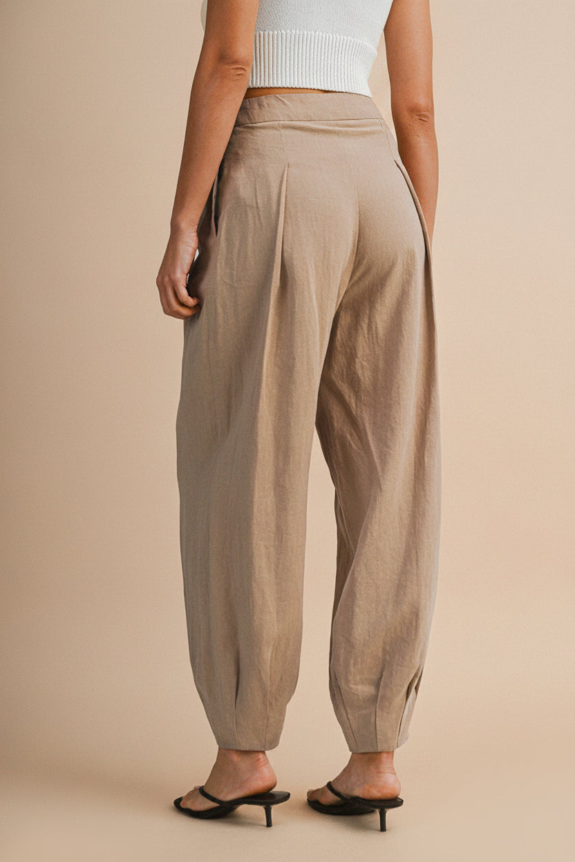 Back view of a Woman wearing the Veraval Taupe Barrel Cut Pants from la petite garçonne