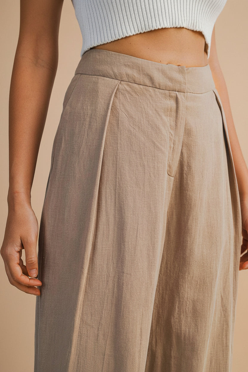 Close up of a Woman wearing the Veraval Taupe Barrel Cut Pants from la petite garçonne