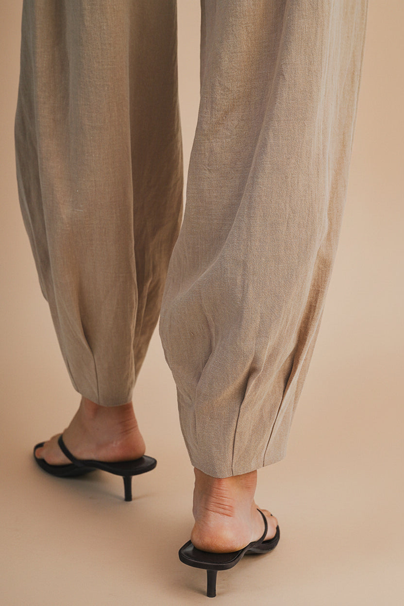 Woman wearing the Veraval Taupe Barrel Cut Pants from la petite garçonne