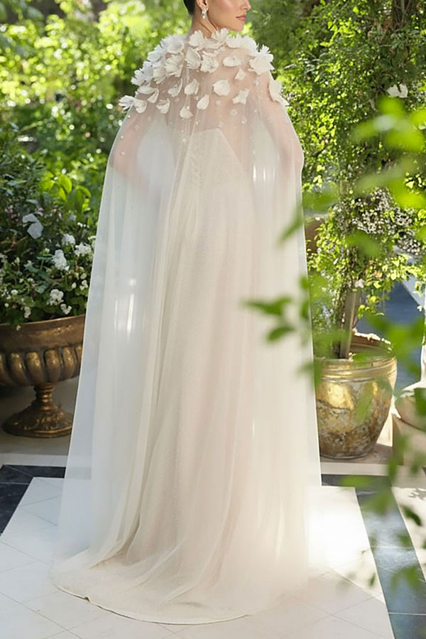 a woman wearing Volina Ivory Floral Embroidered Tulle Cape with Feathers | Boudoir 1861