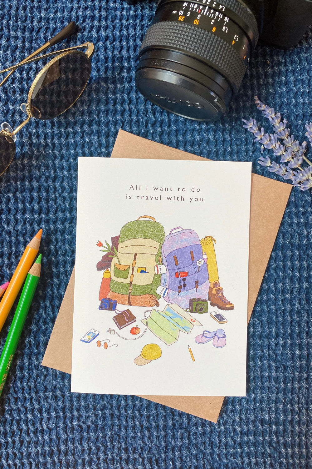 Greeting card with travel-themed illustration with the text "all i want is to travel with you".