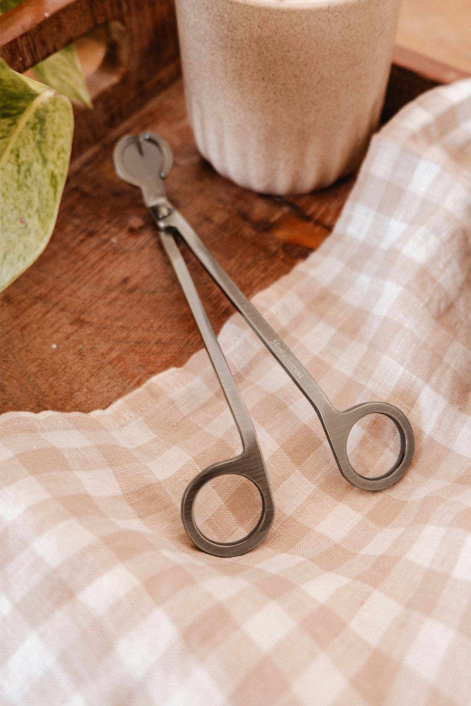 lifestyle view of Antique Wick Trimmer Stainless Steel Accessory at Maison garçonne