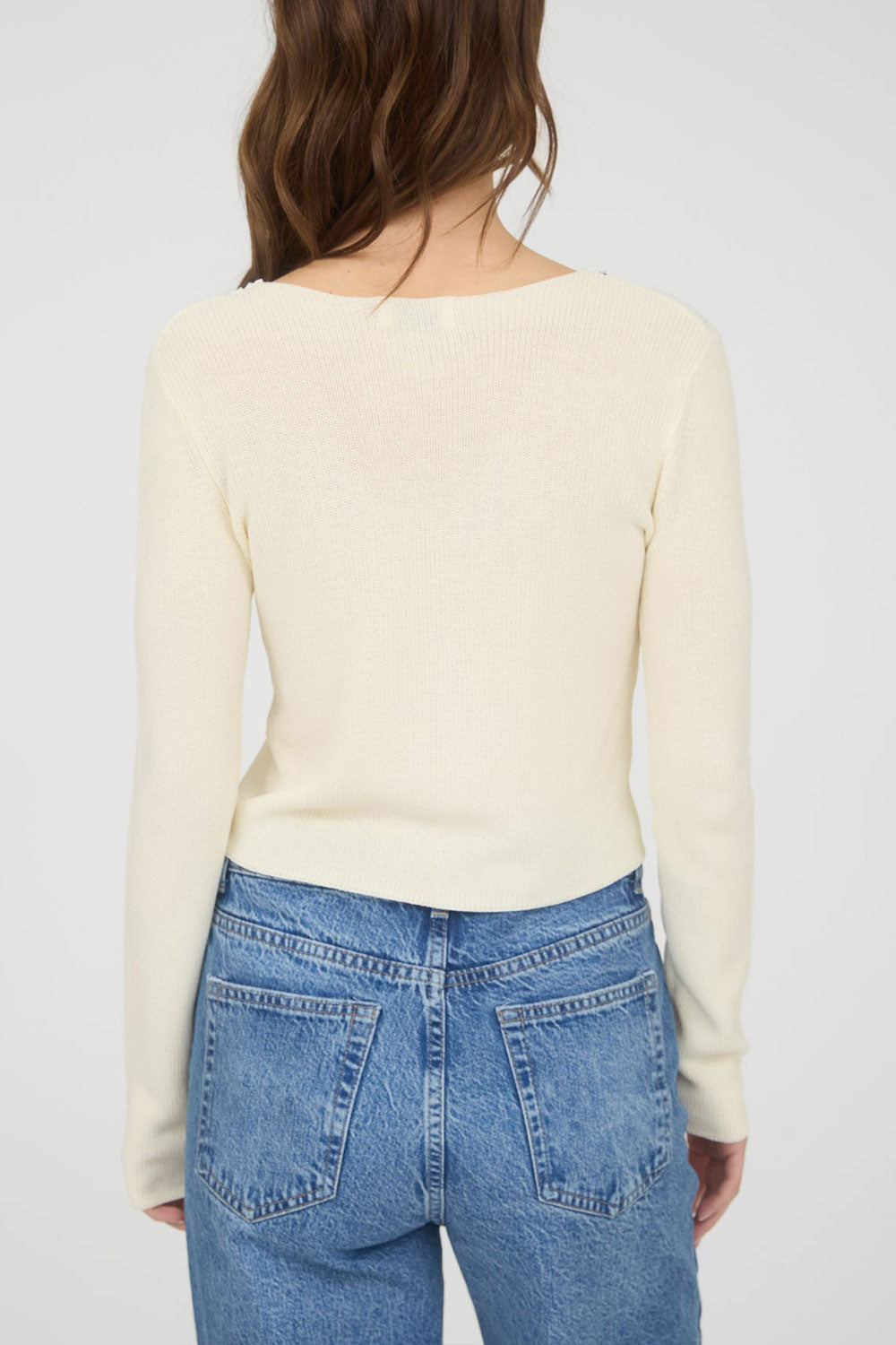 Woman wearing Zafreya Beige Cardigan with Black Ribbon Tie from Boutique 1861 back