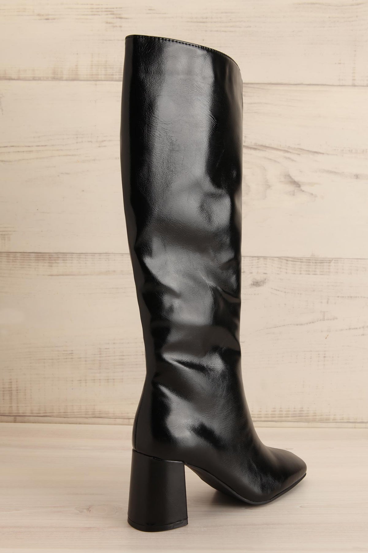 back view of Ahrensburg Black Faux Leather Boots at La petite garçonne