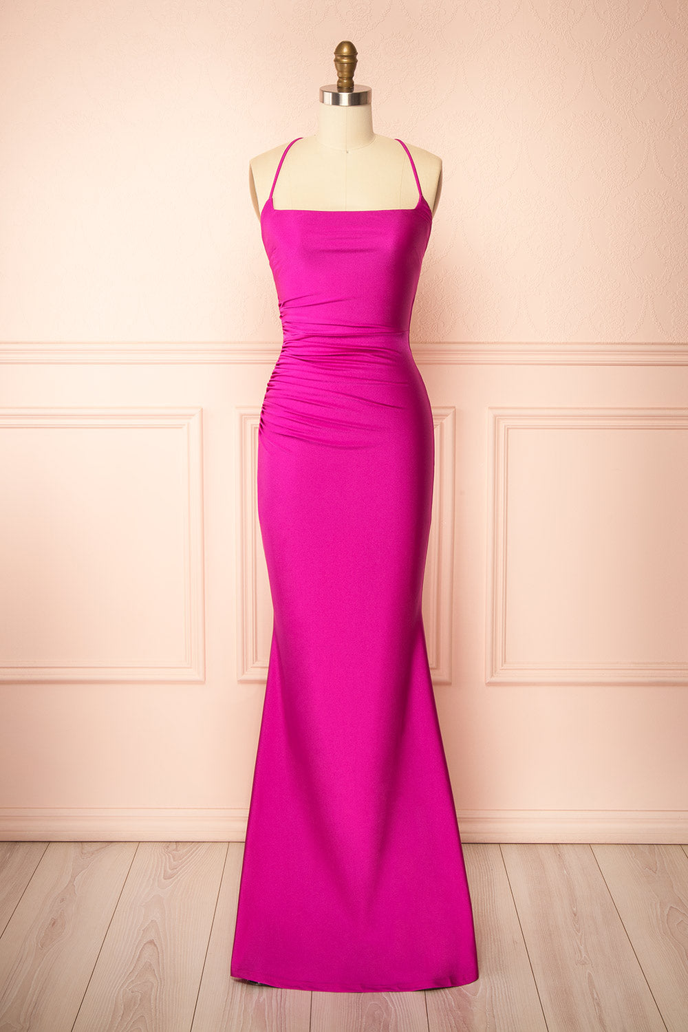 front view of a sewing mannequin wearing the Akari Fuchsia  Mermaid Maxi Dress from boutique 1861
