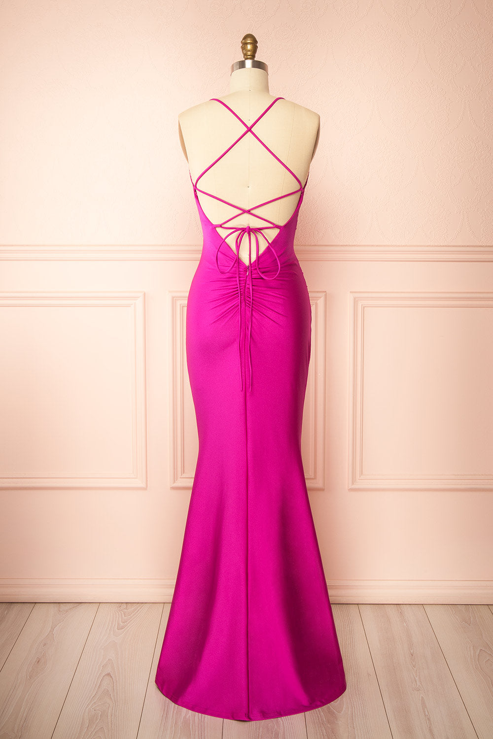 back view of a sewing mannequin wearing the Akari Fuchsia  Mermaid Maxi Dress from boutique 1861