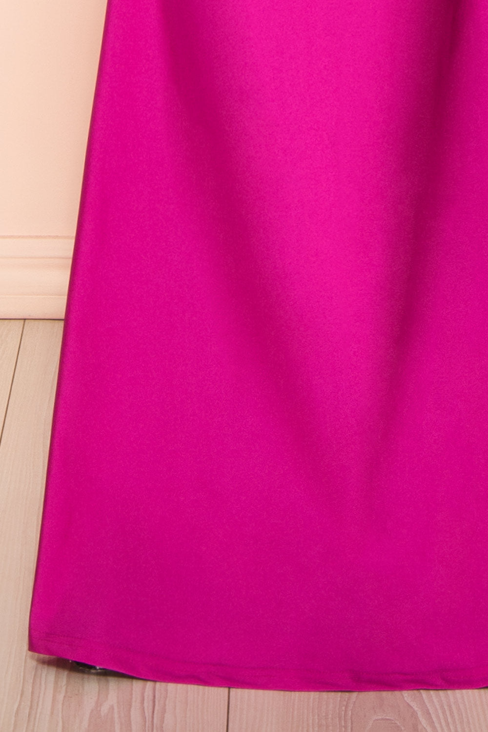 bottom of a sewing mannequin wearing the Akari Fuchsia  Mermaid Maxi Dress from boutique 1861