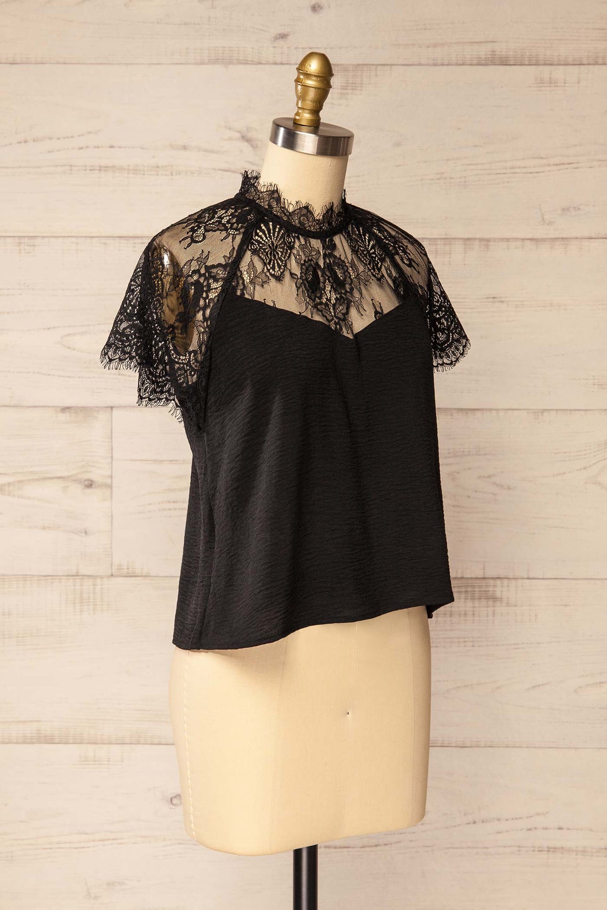 side view of Aksu Black Lace Yoke High-Neck Short Sleeve Top at La petite garçonne