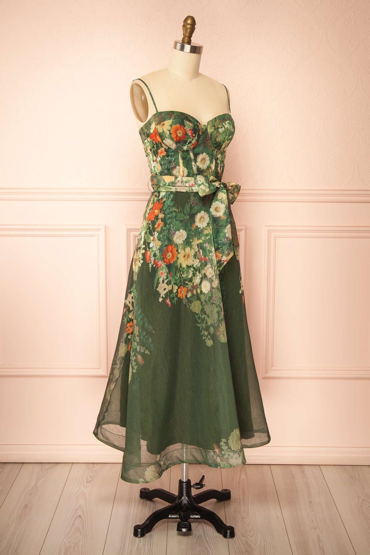 side view of Akulina Green Floral Midi Corset Dress with Pockets at Boutique 1861 