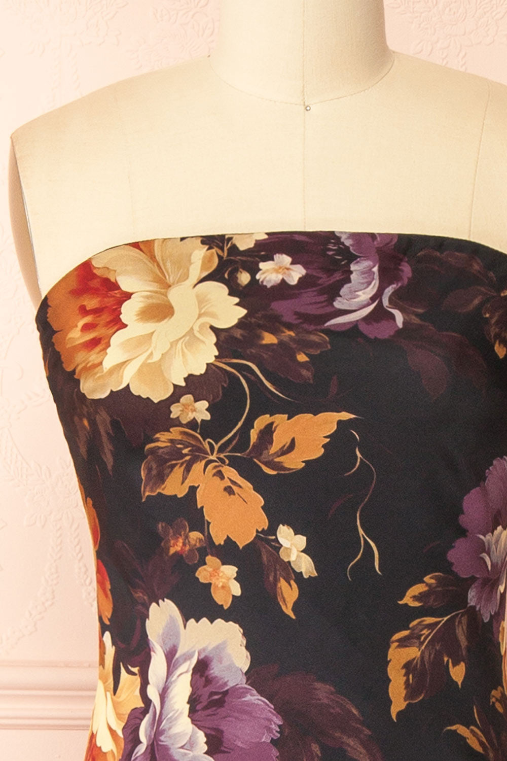 front of a mannequin wearing the Aleana Floral Satin Strapless Dress from boutique 1861