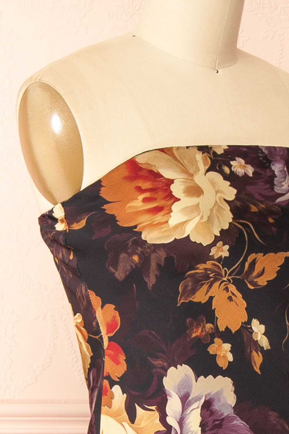 side of a mannequin wearing the Aleana Floral Satin Strapless Dress from boutique 1861