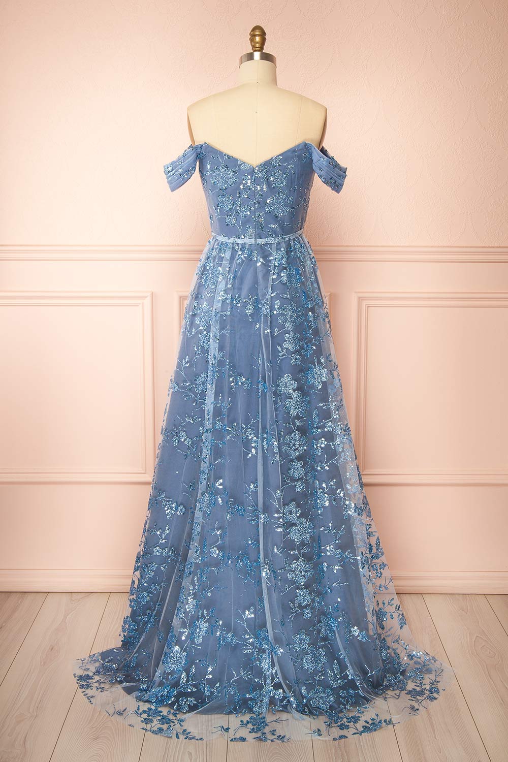back view of sewing mannequin wearing Alienor Blue Grey Glittery Off the Shoulder Maxi Dress from Boutique 1861
