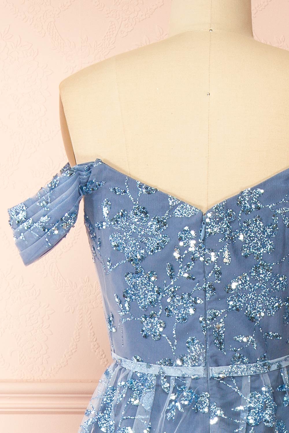 back of sewing mannequin wearing Alienor Blue Grey Glittery Off the Shoulder Maxi Dress from Boutique 1861