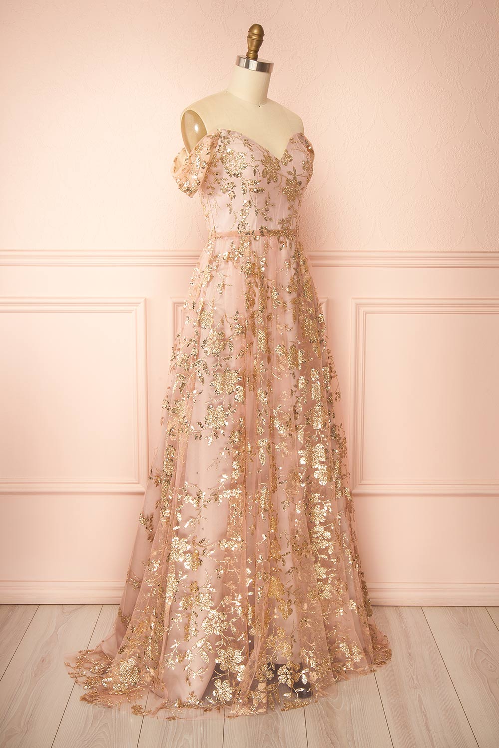 side view of sewing mannequin wearing Alienor Taupe Glittery Off the Shoulder Maxi Dress from Boutique 1861