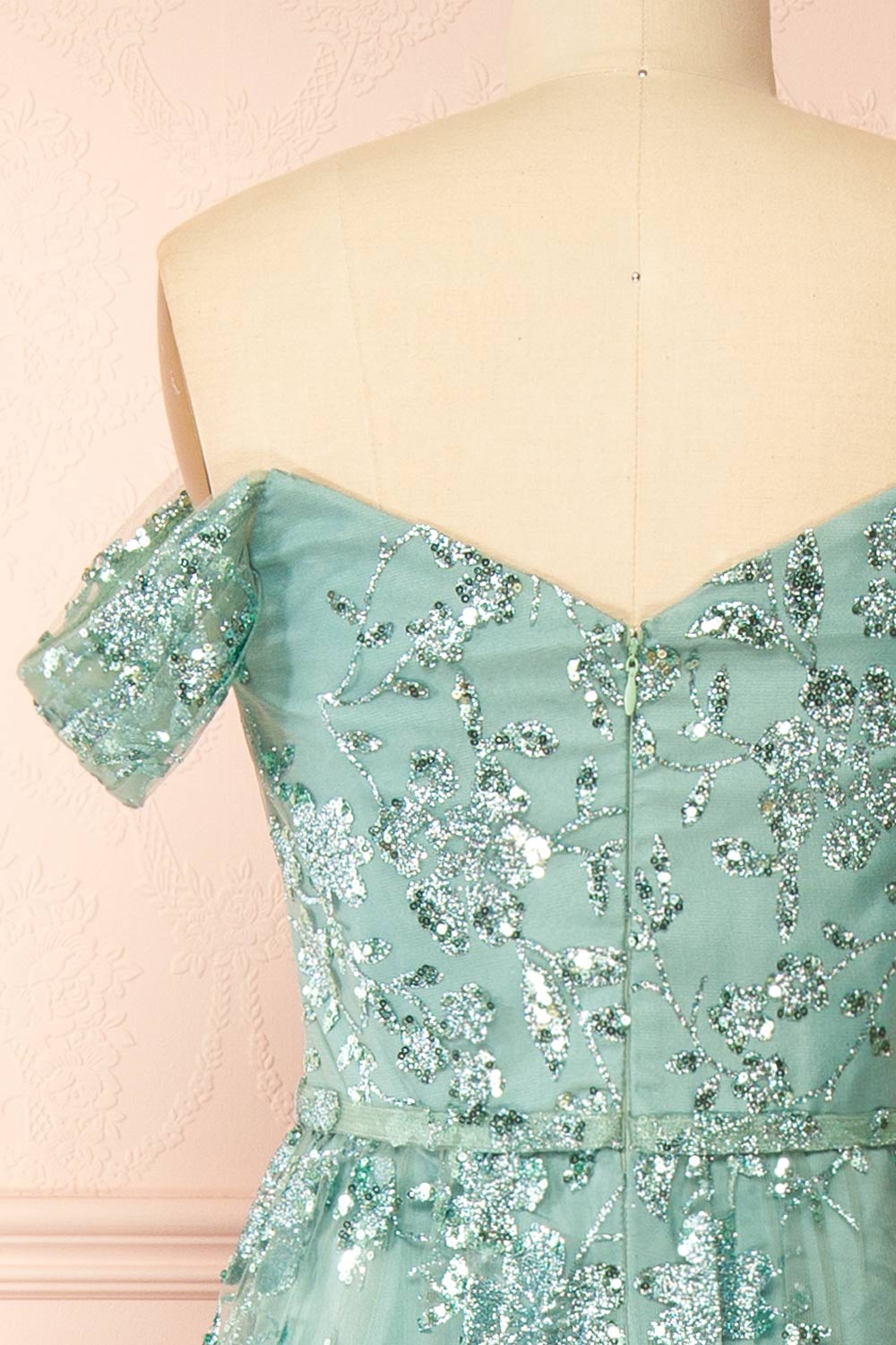 backv of sewing mannequin wearing Alienor Teal Glittery Off the Shoulder Maxi Dress from Boutique 1861