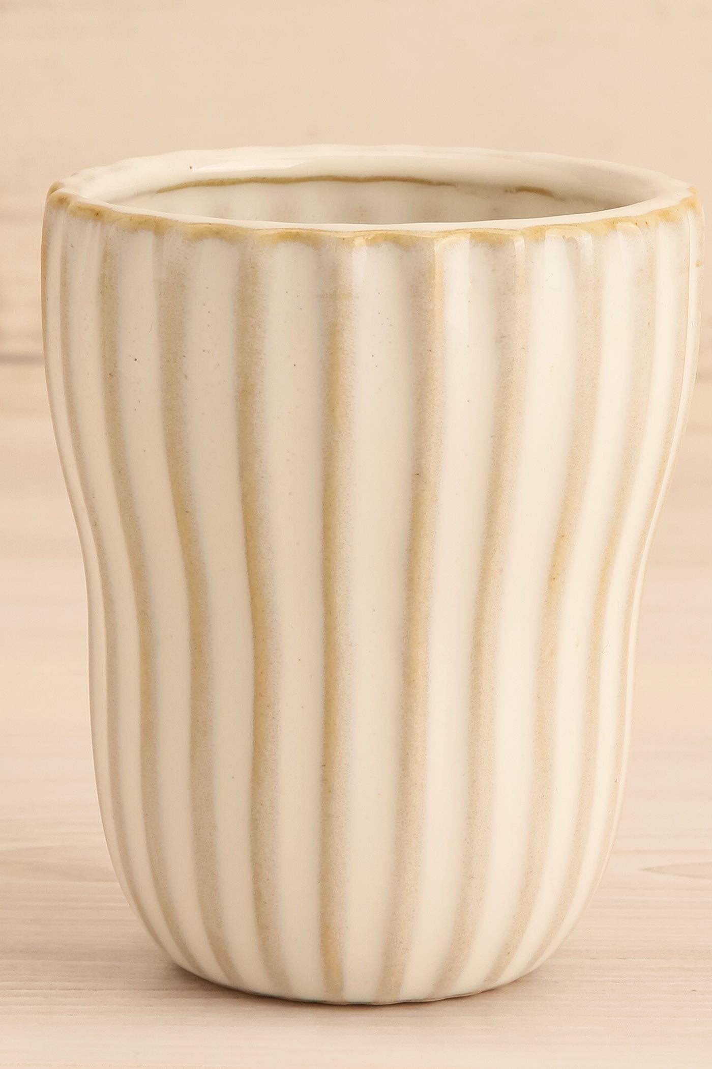 close-up view of Alsleben Small Ribbed Ceramic Cup at Maison garçonne