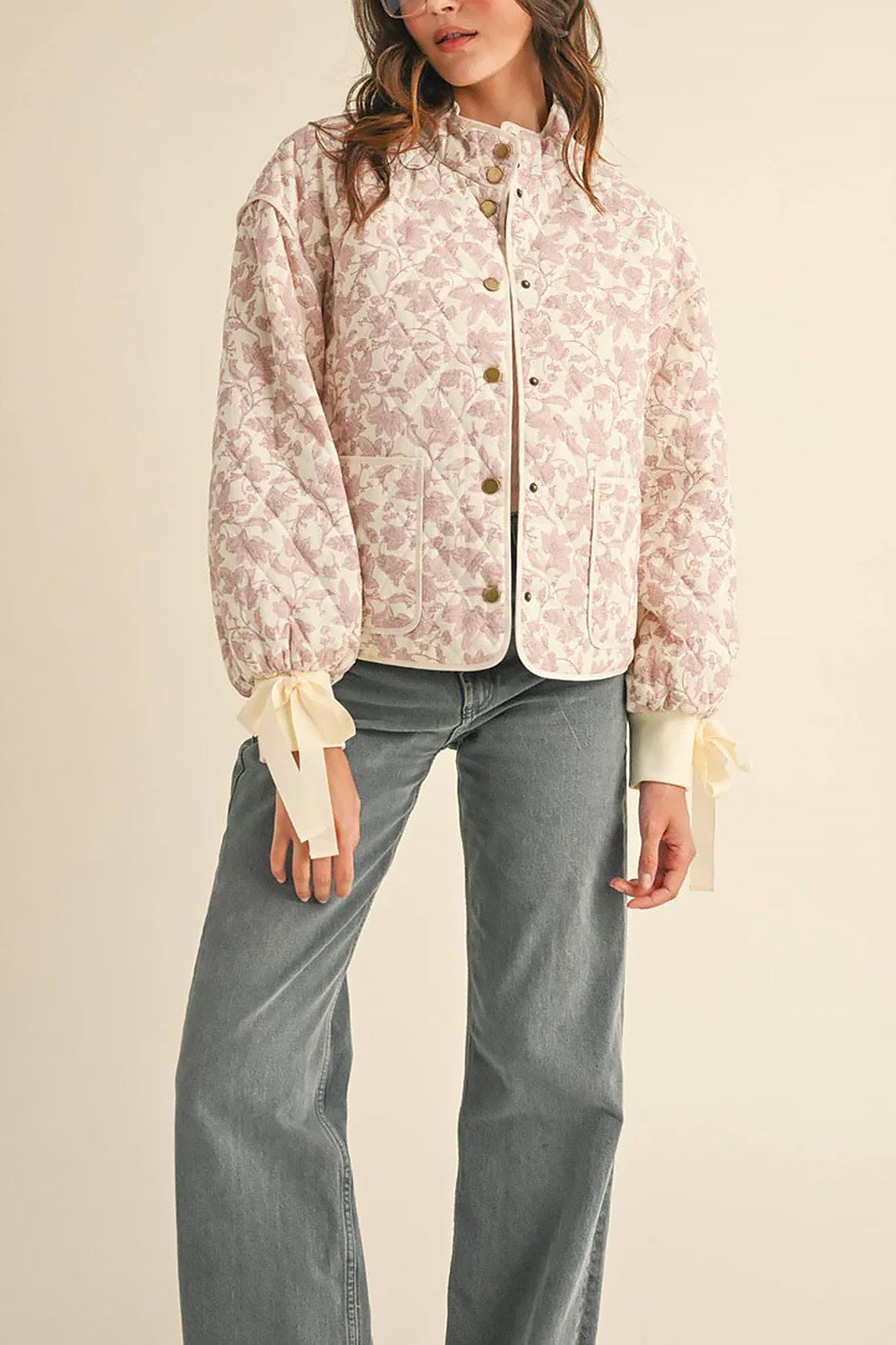 front view of a woman wearing Anabeth Pink Floral Quilted Jacket with Ribbon-Tied from Boutique 1861