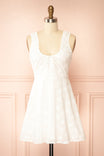 Front view Anysa White Floral Eyelet Mini Dress with Front Tie at boutique 1861