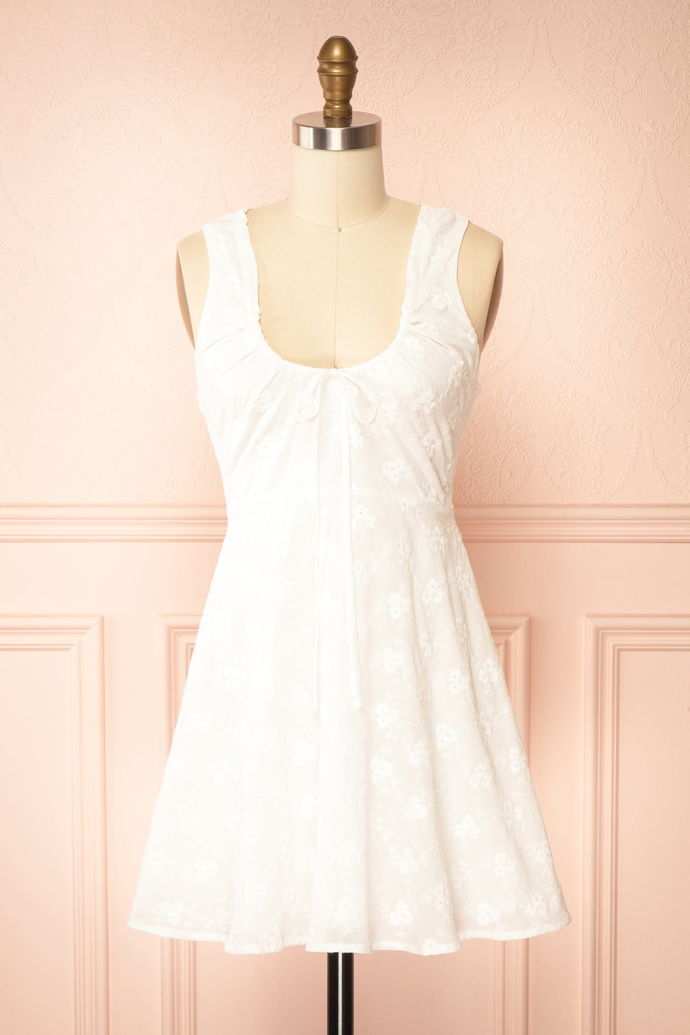 Front view Anysa White Floral Eyelet Mini Dress with Front Tie at boutique 1861