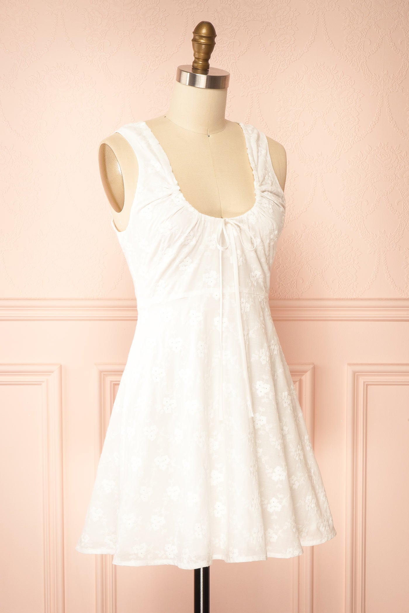 Profile view Anysa White Floral Eyelet Mini Dress with Front Tie at boutique 1861