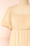 Araminta Beige Pleated Maxi Babydoll Dress | Boutique 1861 front close-up
