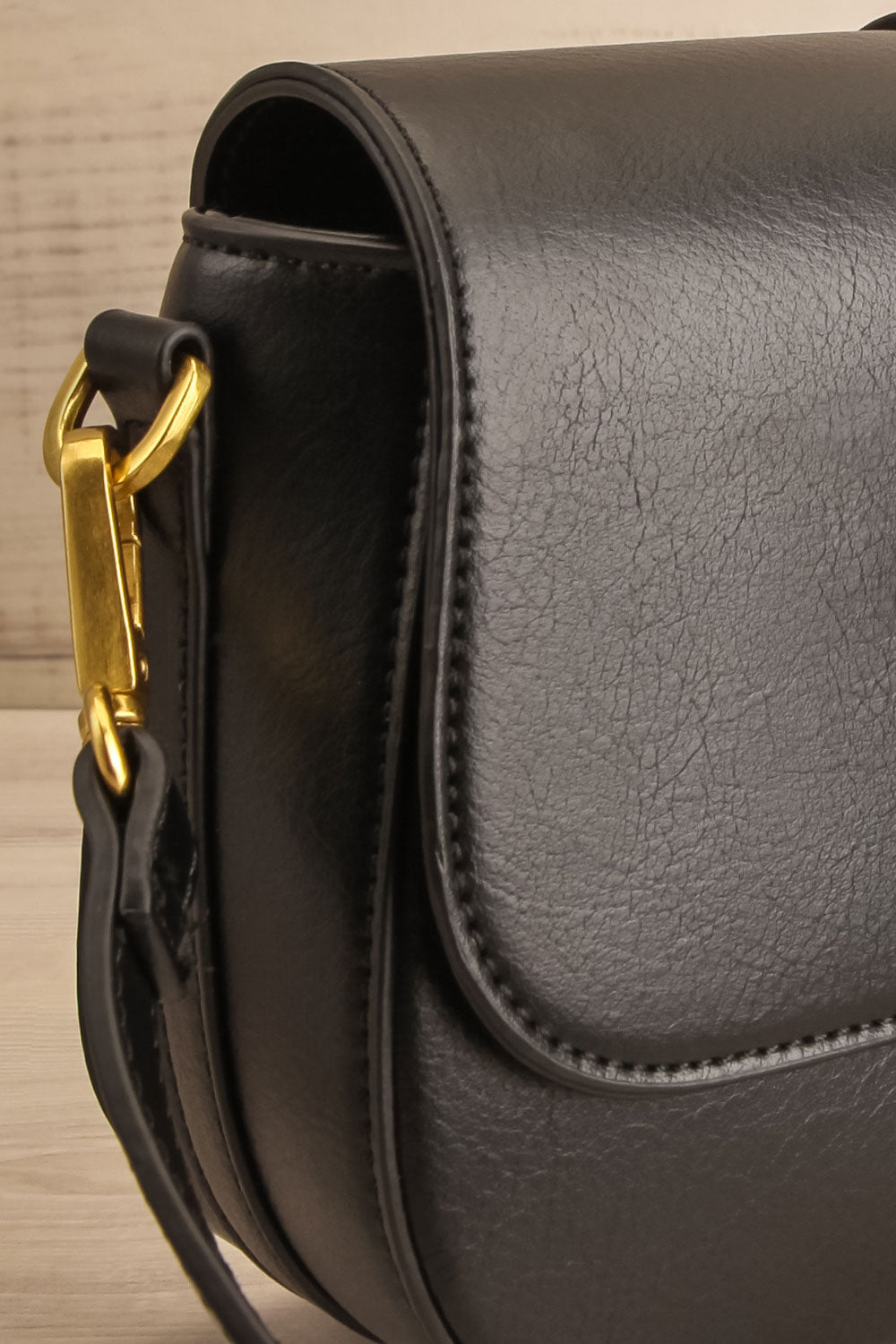 Athenna Black Vegan Leather Saddle Bag | La petite garçonne side close-up