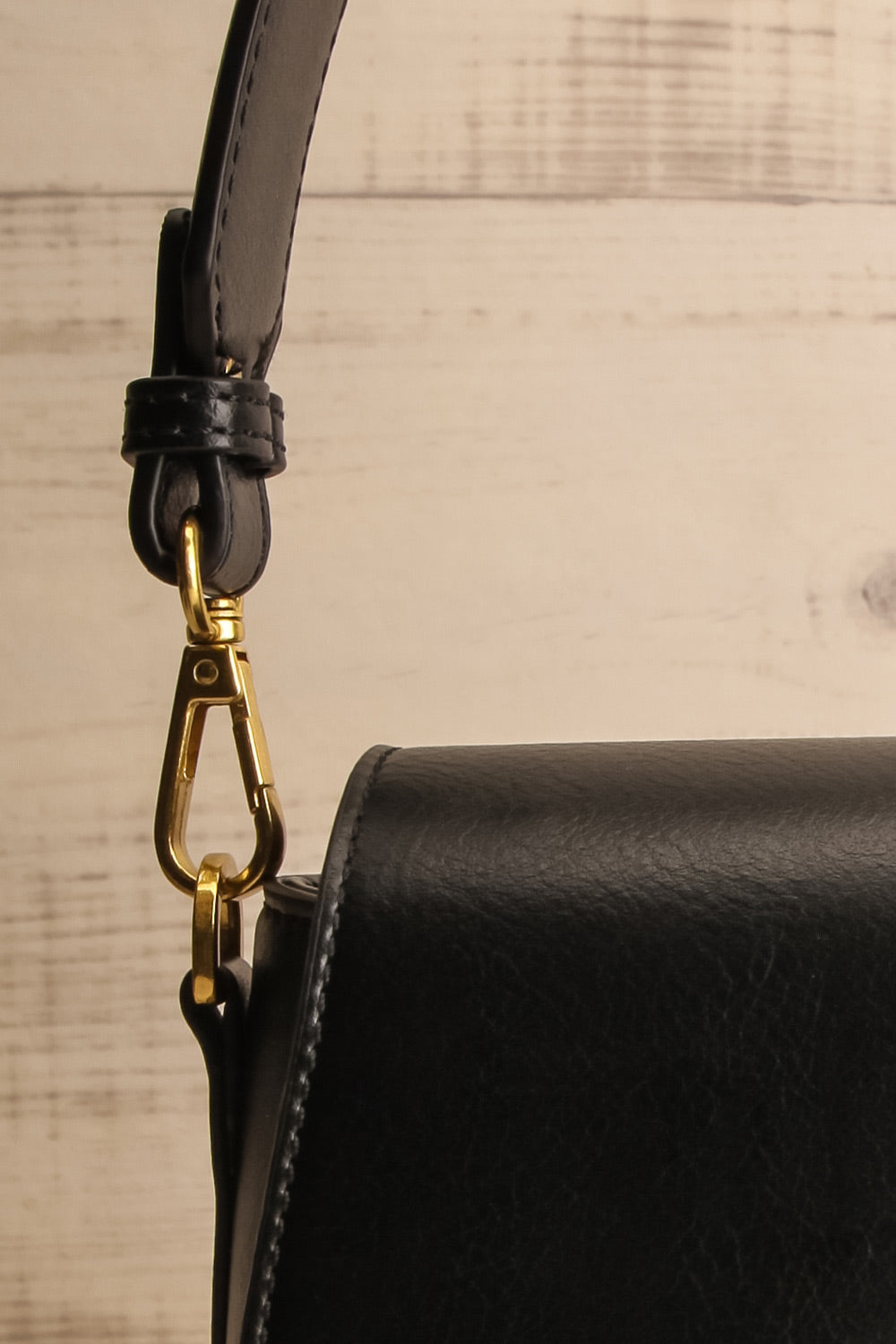 Athenna Black Vegan Leather Saddle Bag | La petite garçonne strap close-up