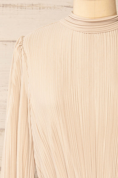 Atyrau Beige Short Pleated Dress w/ Long Sleeves | La petite garçonne front close-up