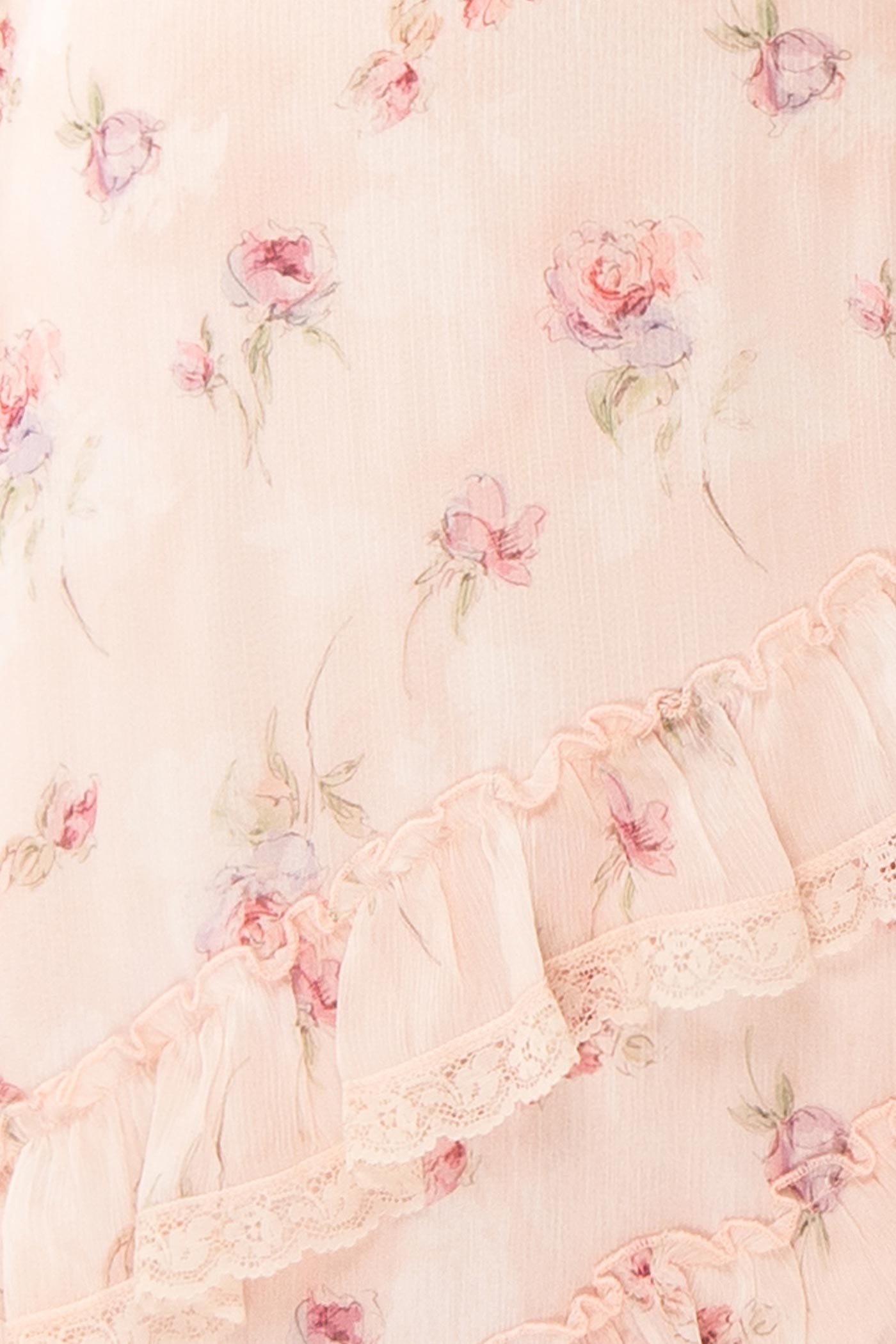 Close-up Aventina Blush Maxi Dress with Ruffles and Floral Pattern at la boutique 1861
