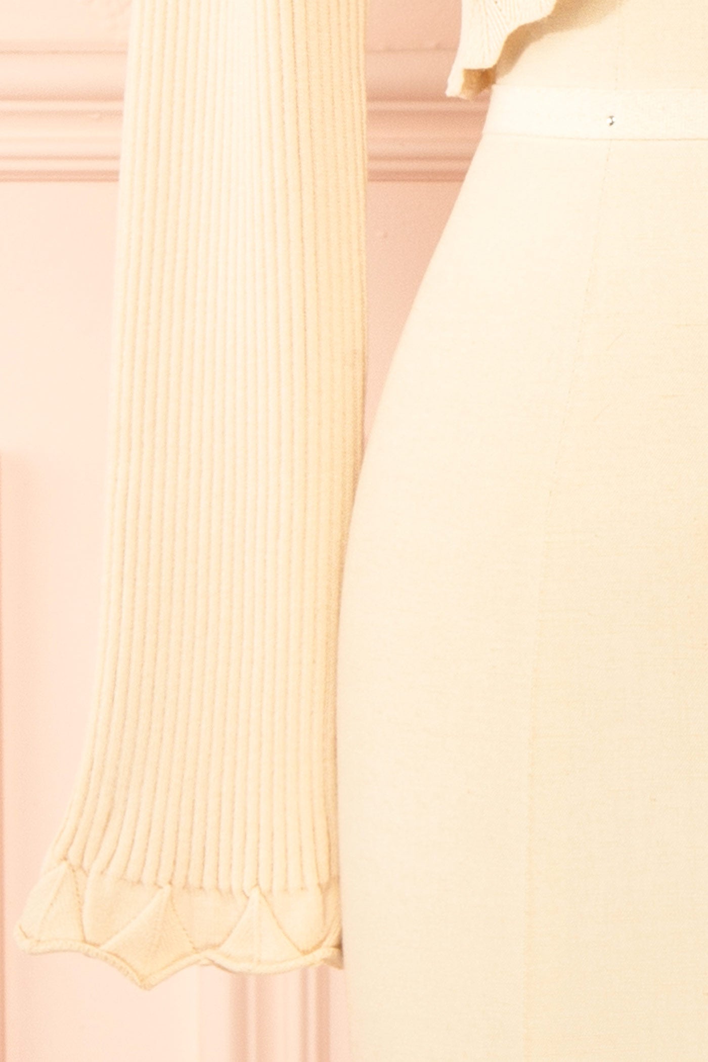 Close-up of Averie Beige Cropped Knit Bolero with Scalloped Edges from boutique 1861.