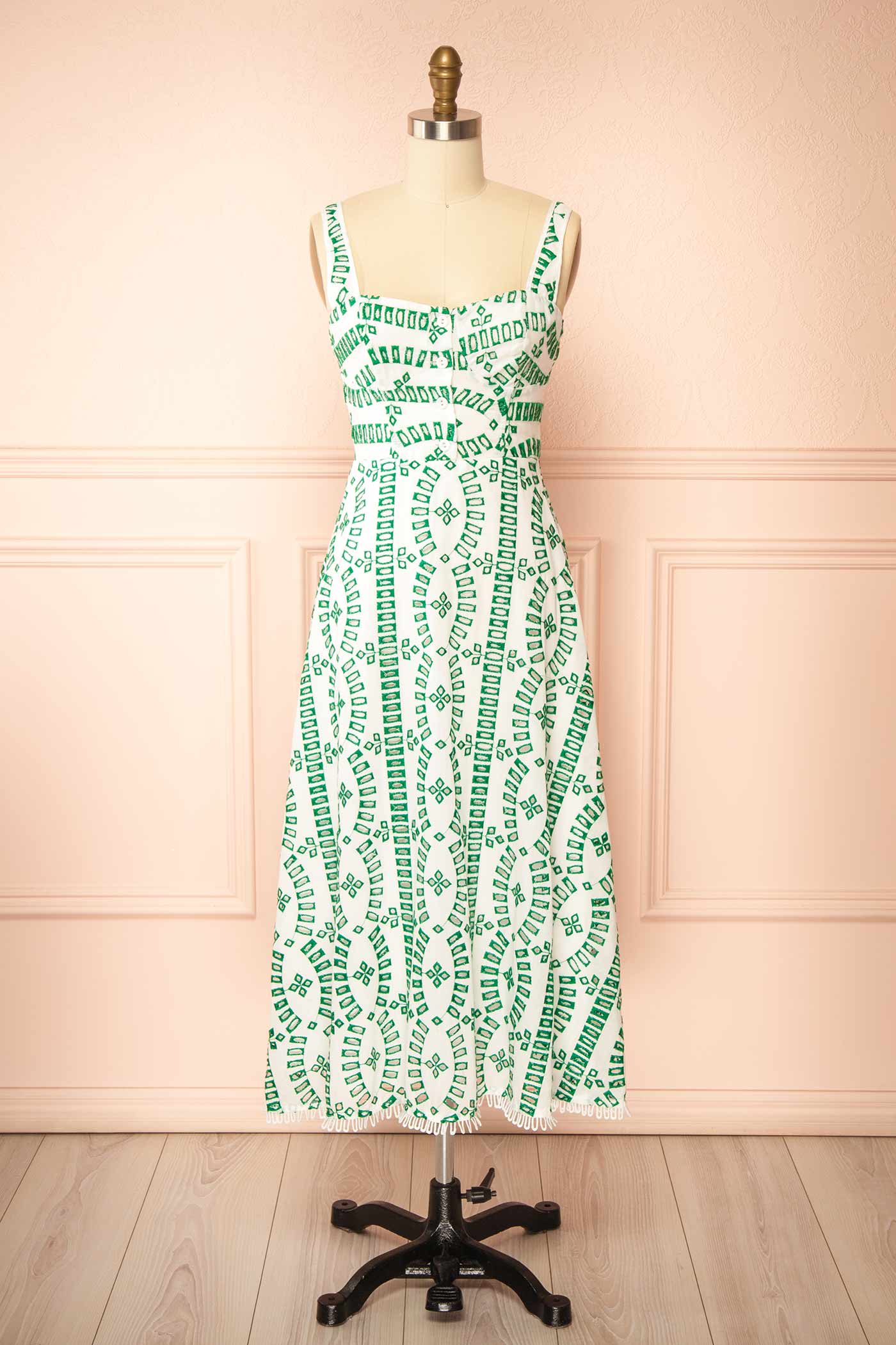 Frontview of Averil | Midi Dress with Geometric Embroidery on mannequin from boutique 1861