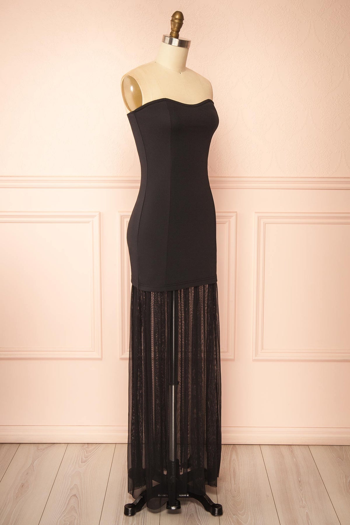 side view of Axelia Black Strapless Maxi Dress with Sheer Mesh Hem at Boutique 1861