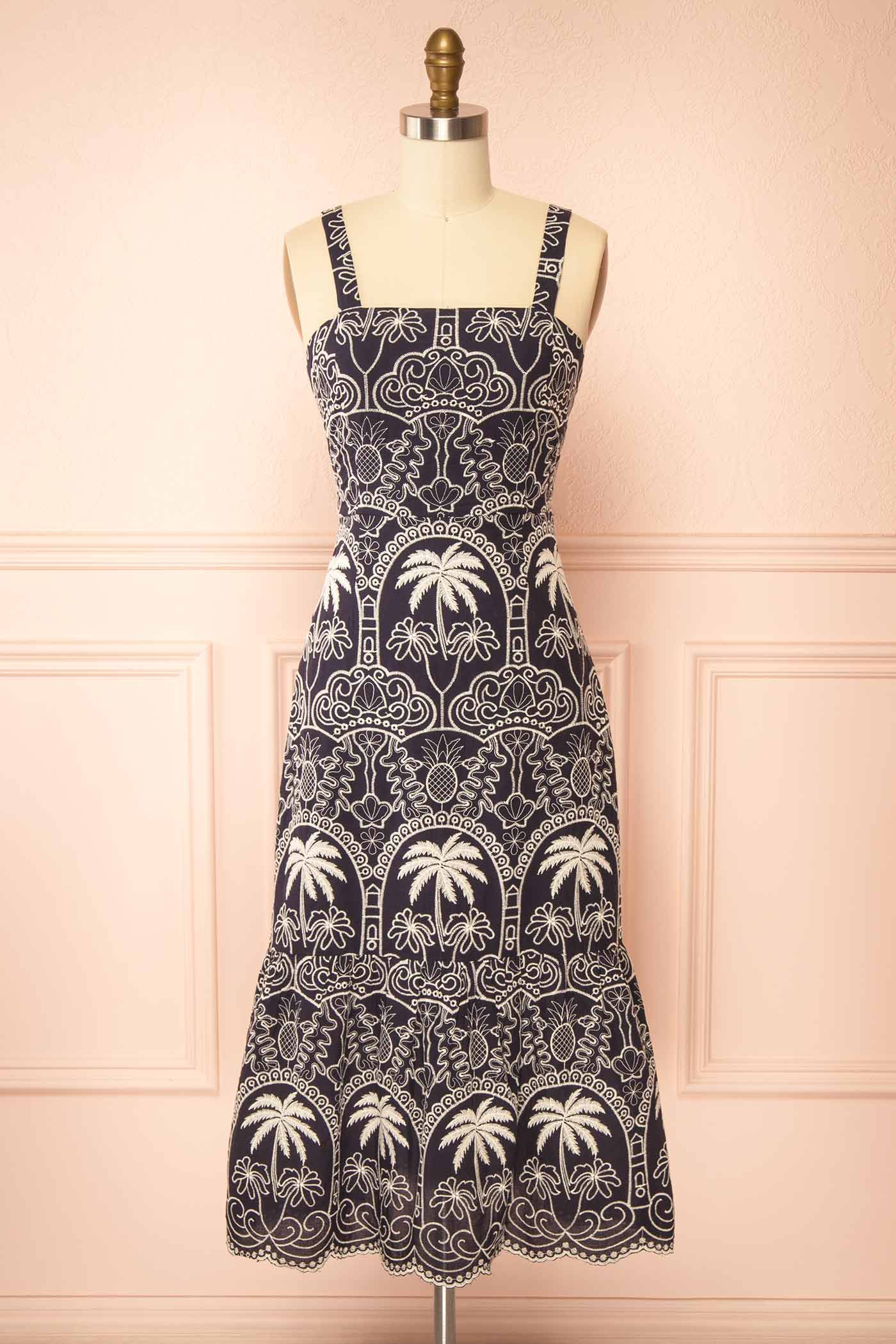 Frontview of Barasat Navy Midi Dress with Embroidery on a mannquin from boutique 1861.